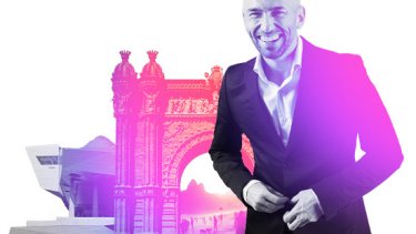 Man in front of IBTM World branded pink arch